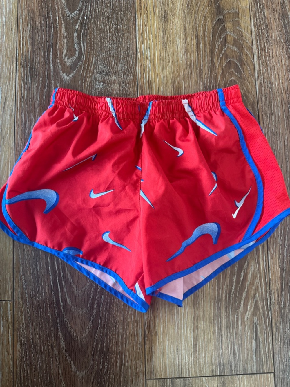 Nike Red Kids' Athletic Shorts with Blue Trim and Swoosh Print